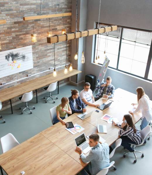 Young people having business meeting in modern office